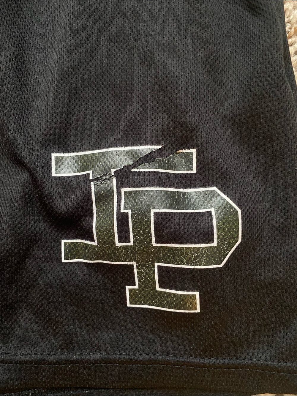 Black Athletic Shorts with White-Outlined Logo